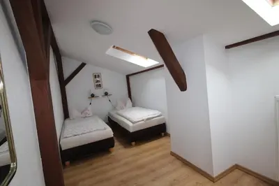Ein Bett oder Betten in einem Zimmer der Unterkunft Kapitänshaus FW 4 OG re