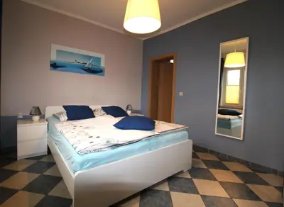 Ein Bett oder Betten in einem Zimmer der Unterkunft Kapitänshaus FW 1 EG li