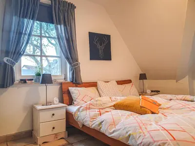 Ein Bett oder Betten in einem Zimmer der Unterkunft Kormoran Wohnung 13