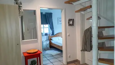 Ein Bett oder Betten in einem Zimmer der Unterkunft Kormoran Wohnung 13