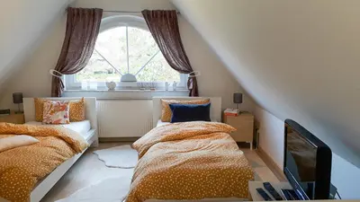 Ein Bett oder Betten in einem Zimmer der Unterkunft Kormoran Wohnung 13