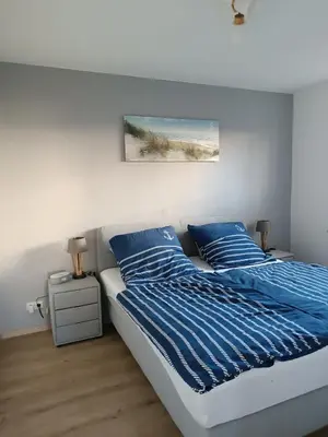 Ein Bett oder Betten in einem Zimmer der Unterkunft Ostseemeerchen