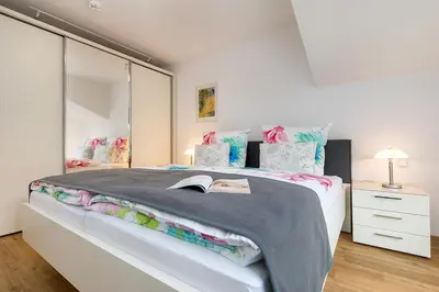 Ein Bett oder Betten in einem Zimmer der Unterkunft Fewo Zingstblick - im Herzen von Zingst