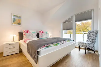 Ein Bett oder Betten in einem Zimmer der Unterkunft Fewo Zingstblick - im Herzen von Zingst