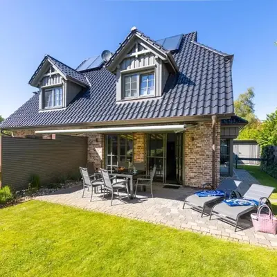 Küstenglück Zingst - hochwertiges Ferienhaus nahe Strand mit Garten & Kamin