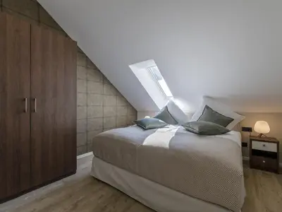 Ein Bett oder Betten in einem Zimmer der Unterkunft Alte Seefahrtschule App 86 