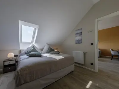 Ein Bett oder Betten in einem Zimmer der Unterkunft Alte Seefahrtschule App 86 