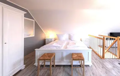 Ein Bett oder Betten in einem Zimmer der Unterkunft Darßer Weg 36a Whg 10 