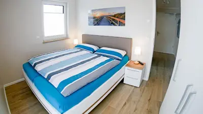 Ein Bett oder Betten in einem Zimmer der Unterkunft Beachside Zingst - Exklusiv und Strandnah