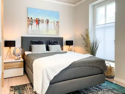 Ein Bett oder Betten in einem Zimmer der Unterkunft Sonnenseite Panoramaliebe, App 21