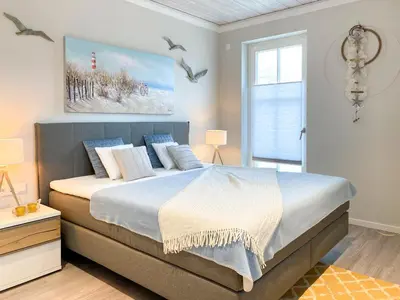 Ein Bett oder Betten in einem Zimmer der Unterkunft Sonnenseite Panoramaliebe, App 21