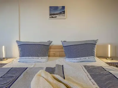 Ein Bett oder Betten in einem Zimmer der Unterkunft Speicherresidenz App 1 5 - Hafenblick