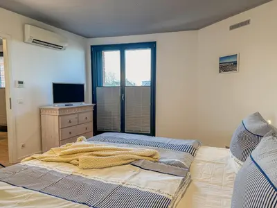 Ein Bett oder Betten in einem Zimmer der Unterkunft Speicherresidenz App 1 5 - Hafenblick