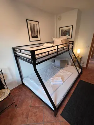 Ein Bett oder Betten in einem Zimmer der Unterkunft Kapitänshaus - Terrassenstube