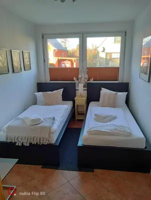 Ein Bett oder Betten in einem Zimmer der Unterkunft Kapitänshaus - Terrassenstube
