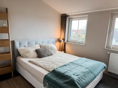 Ein Bett oder Betten in einem Zimmer der Unterkunft Whg 16 - Sol - b71175
