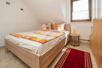 Ein Bett oder Betten in einem Zimmer der Unterkunft Haus Ahrens Wohnung 5