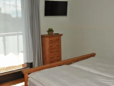 Ein Bett oder Betten in einem Zimmer der Unterkunft Barther Hafensonne