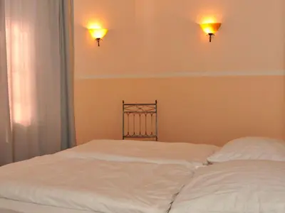 Ein Bett oder Betten in einem Zimmer der Unterkunft Barther Hafensonne