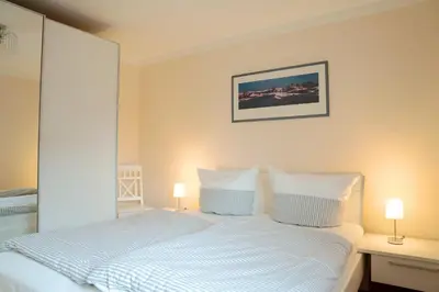 Ein Bett oder Betten in einem Zimmer der Unterkunft Kavelweg 33a Villa Arielle Wohnung 2