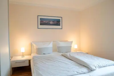 Ein Bett oder Betten in einem Zimmer der Unterkunft Kavelweg 33a Villa Arielle Wohnung 2