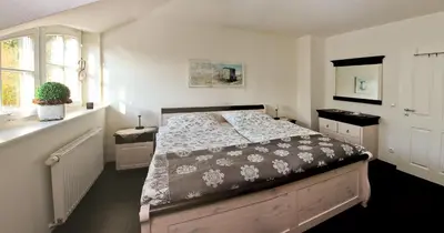 Ein Bett oder Betten in einem Zimmer der Unterkunft Müggenburger Weg 36 - Zingster Traum 1