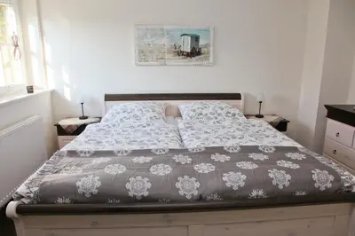 Ein Bett oder Betten in einem Zimmer der Unterkunft Müggenburger Weg 36 - Zingster Traum 1