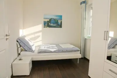 Ein Bett oder Betten in einem Zimmer der Unterkunft Müggenburger Weg 36 - Zingster Traum 1