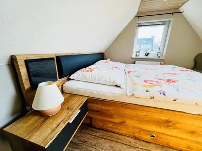 Ein Bett oder Betten in einem Zimmer der Unterkunft Sonnenblume - Sonne 1 links