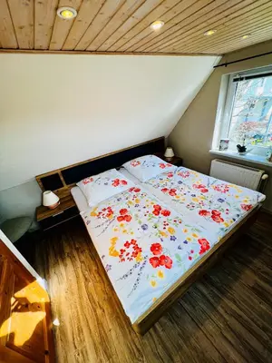 Ein Bett oder Betten in einem Zimmer der Unterkunft Sonnenblume - Sonne 1 links