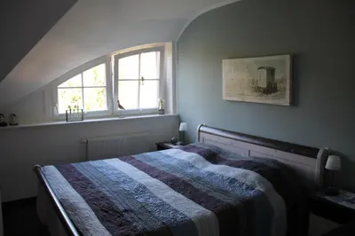 Ein Bett oder Betten in einem Zimmer der Unterkunft Müggenburger Weg 36 - Zingster Traum 2