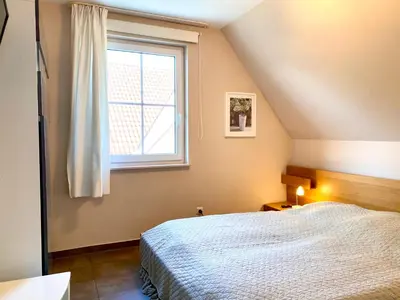Ein Bett oder Betten in einem Zimmer der Unterkunft Kavelweg 8 - Utspann