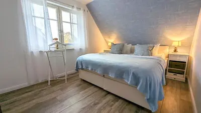 Ein Bett oder Betten in einem Zimmer der Unterkunft Haus Kiek in Kirr