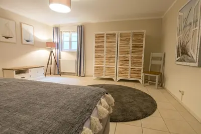 Ein Bett oder Betten in einem Zimmer der Unterkunft Achtern Diek Haus 2a
