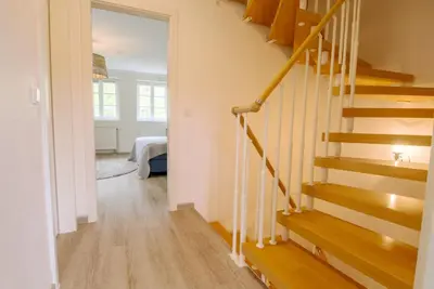 Ein Bett oder Betten in einem Zimmer der Unterkunft Achtern Diek Haus 2a