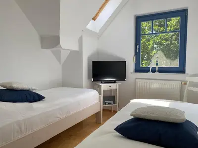 Ein Bett oder Betten in einem Zimmer der Unterkunft Wiesenstraße 21a Haus Zum Kranich