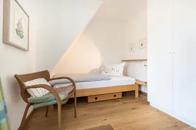 Ein Bett oder Betten in einem Zimmer der Unterkunft Achtern Diek Haus 2b