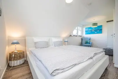 Ein Bett oder Betten in einem Zimmer der Unterkunft Gänseweg 5a Haus Backbordhus