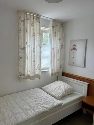 Ein Bett oder Betten in einem Zimmer der Unterkunft Achtern Diek Haus 3b Wohnung 3