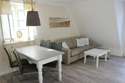 Ein Sitzbereich in der Unterkunft Achtern Diek Haus 3a Wohnung 5