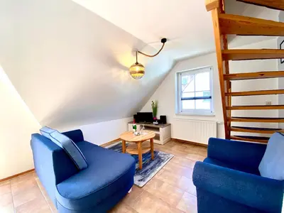 Ein Sitzbereich in der Unterkunft Hägerende 66a Haus Ankerplatz Wohnung Peildeck