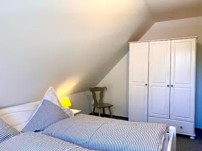 Ein Bett oder Betten in einem Zimmer der Unterkunft Hägerende 66a Haus Ankerplatz Wohnung Peildeck