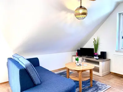 Ein Sitzbereich in der Unterkunft Hägerende 66a Haus Ankerplatz Wohnung Peildeck
