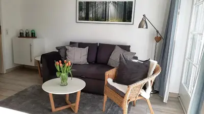 Ein Sitzbereich in der Unterkunft Achtern Diek Haus 7 Wohnung 2