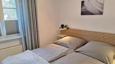 Ein Bett oder Betten in einem Zimmer der Unterkunft Achtern Diek Haus 7 Wohnung 2