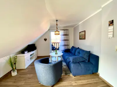 Ein Sitzbereich in der Unterkunft Hägerende 66 Haus Windrose Wohnung Südwind