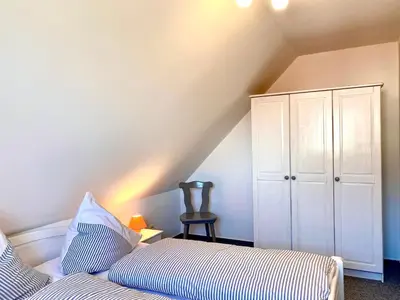 Ein Bett oder Betten in einem Zimmer der Unterkunft Hägerende 66 Haus Windrose Wohnung Südwind