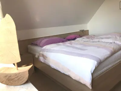 Ein Bett oder Betten in einem Zimmer der Unterkunft Wohnung Darßer Weg 10b