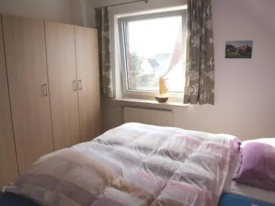 Ein Bett oder Betten in einem Zimmer der Unterkunft Wohnung Darßer Weg 10b