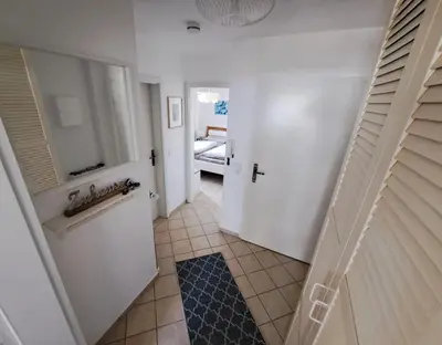 Ein Bett oder Betten in einem Zimmer der Unterkunft Achtern Diek Haus 7 Wohnung 4